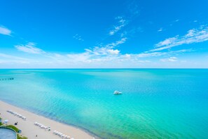 On the beach, sun loungers, beach towels