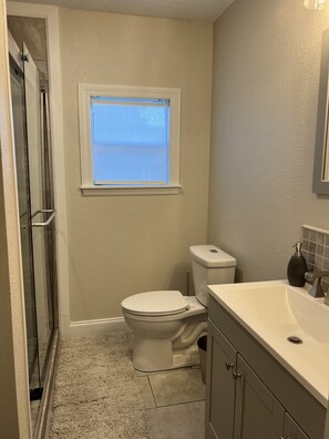 Shower, towels, soap, toilet paper