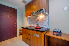 Studio | Private kitchen - Homey And Relaxing Studio Grand Dhika City Apartment (Bekasi)