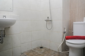 Studio | Bathroom | Shower, free toiletries, towels - Homey And Minimalist Studio Grand Dhika City Apartment (Bekasi)