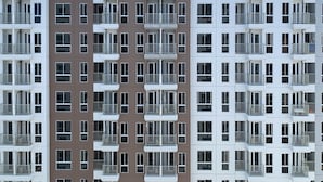 A multi-story residential building with balconies and a uniform facade. - Best Deal Studio Tokyo Riverside Pik 2 Apartment (Teluknaga)