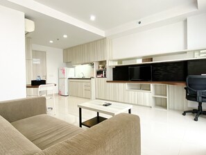 Studio | Living area - Cozy And Nice Studio At Azalea Suites Apartment (Cikarang)