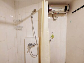 Studio | Bathroom | Shower, free toiletries, towels - Brand New And Homey Studio At Mataram City Apartment (Ngaglik)