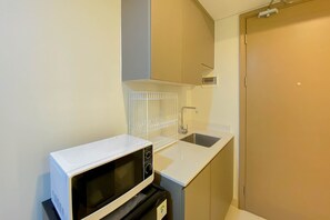 Apartment | Private kitchen | Fridge, microwave - Modern And Homey 1Br (No Kitchen) Gold Coast Apartment (Jakarta)