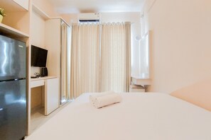 Relax in a stylish room with a comfortable bed, flat-screen TV, and modern amenities.