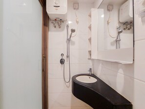 Studio | Bathroom | Shower, towels - Homey And Cozy Studio Sky House Bsd Apartment Near Aeon (Pagedangan)
