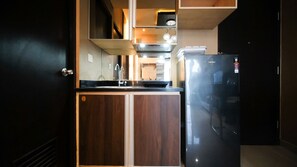 Apartment | Private kitchen | Full-size fridge, stovetop - Good Location And Comfy 2Br At Tamansari Papilio Apartment (Surabaya)