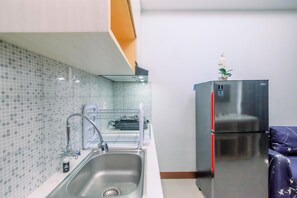 Apartment | Private kitchen | Full-size fridge, stovetop - Comfortable And Simply Look 2Br Royal Heights Apartment (Bogor)