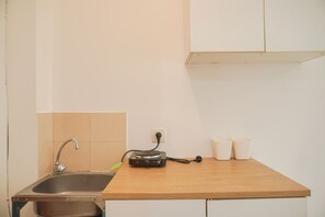 Studio | Private kitchen | Full-sized fridge, stovetop, electric kettle - Best Choice And Homey Studio Tifolia Apartment (Jakarta)