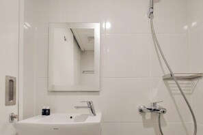 Studio | Bathroom - Scenic And Homey Studio Barsa City Apartment (Yogyakarta)