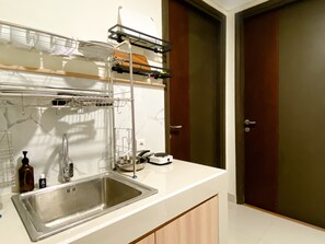 Apartment | Private kitchen | Full-sized fridge, stovetop - Cozy Living 2Br Room Pollux Chadstone Apartment (Cikarang)