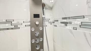 Shower, hair dryer, towels, soap