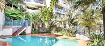 Newly renovated top floor apartment with beautiful views and a pool to enjoy.