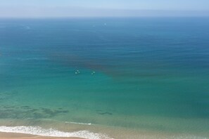 On the beach, sun-loungers, beach towels