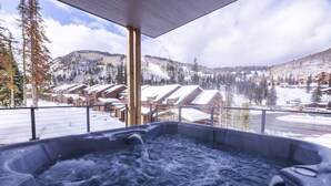 A hot tub with a view of snow-covered buildings and mountains. - Beautiful 3-bedroom townhome at Purgatory Resort with mountain views, perfect for families. (Durango)
