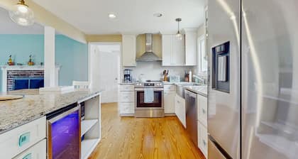 Home near beach & tennis/basketball court with firepit, grill, & patio