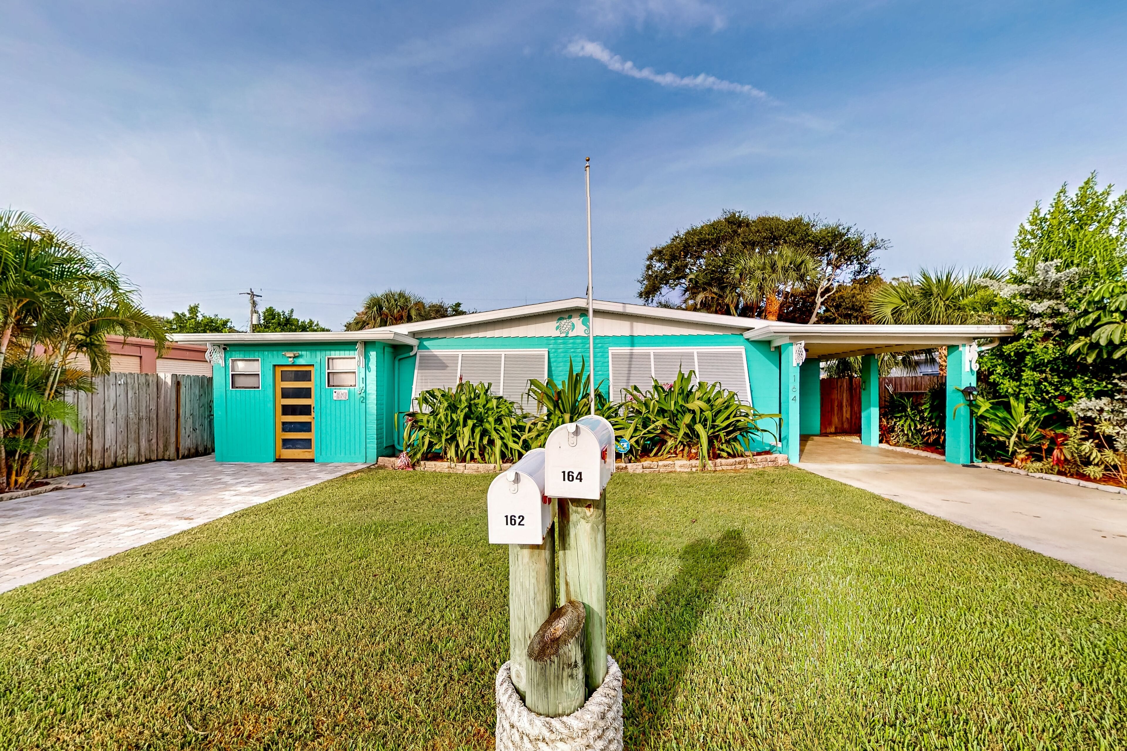 Gorgeous & modern dog-friendly getaway w/ patio, AC, & W/D - steps to the beach