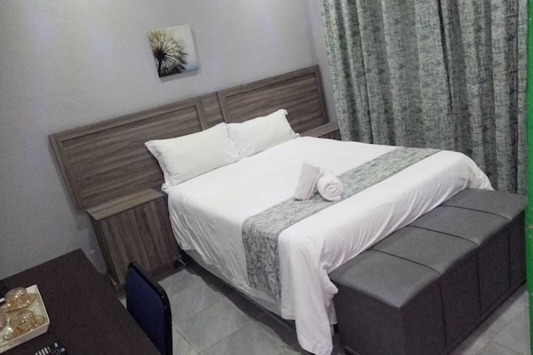 Classic Double Room, 1 Double Bed, Refrigerator, Garden View | Desk, laptop workspace, iron/ironing board (on request), bed sheets