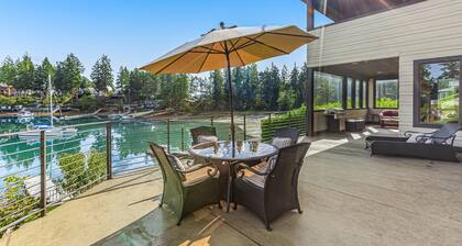Upscale waterfront estate with private dock, fireplace, & gourmet kitchen