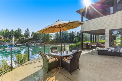 Upscale waterfront estate with private dock, fireplace, & gourmet kitchen
