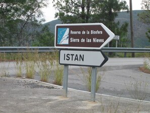 A directional sign for Reserva de la Biosfera Sierra de las Nieves and ISTAN.