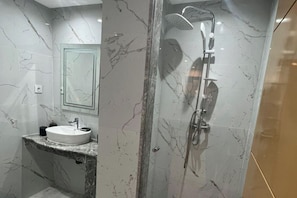 Shower, hair dryer, towels