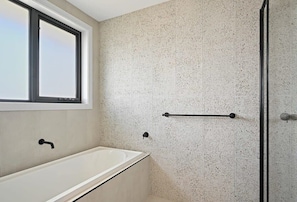 Shower, hair dryer, towels, shampoo