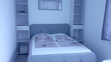 1 bedroom, desk, iron/ironing board, travel crib