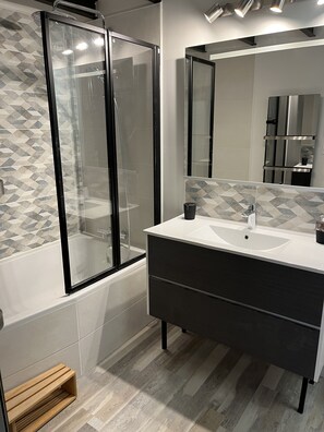 Shower, hair dryer, towels, soap