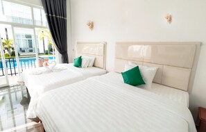 Chambre Classique Double ou avec lits jumeaux, 2 chambres, vue piscine | Bureau, espace de travail pour ordinateur portable, Wi-Fi gratuit