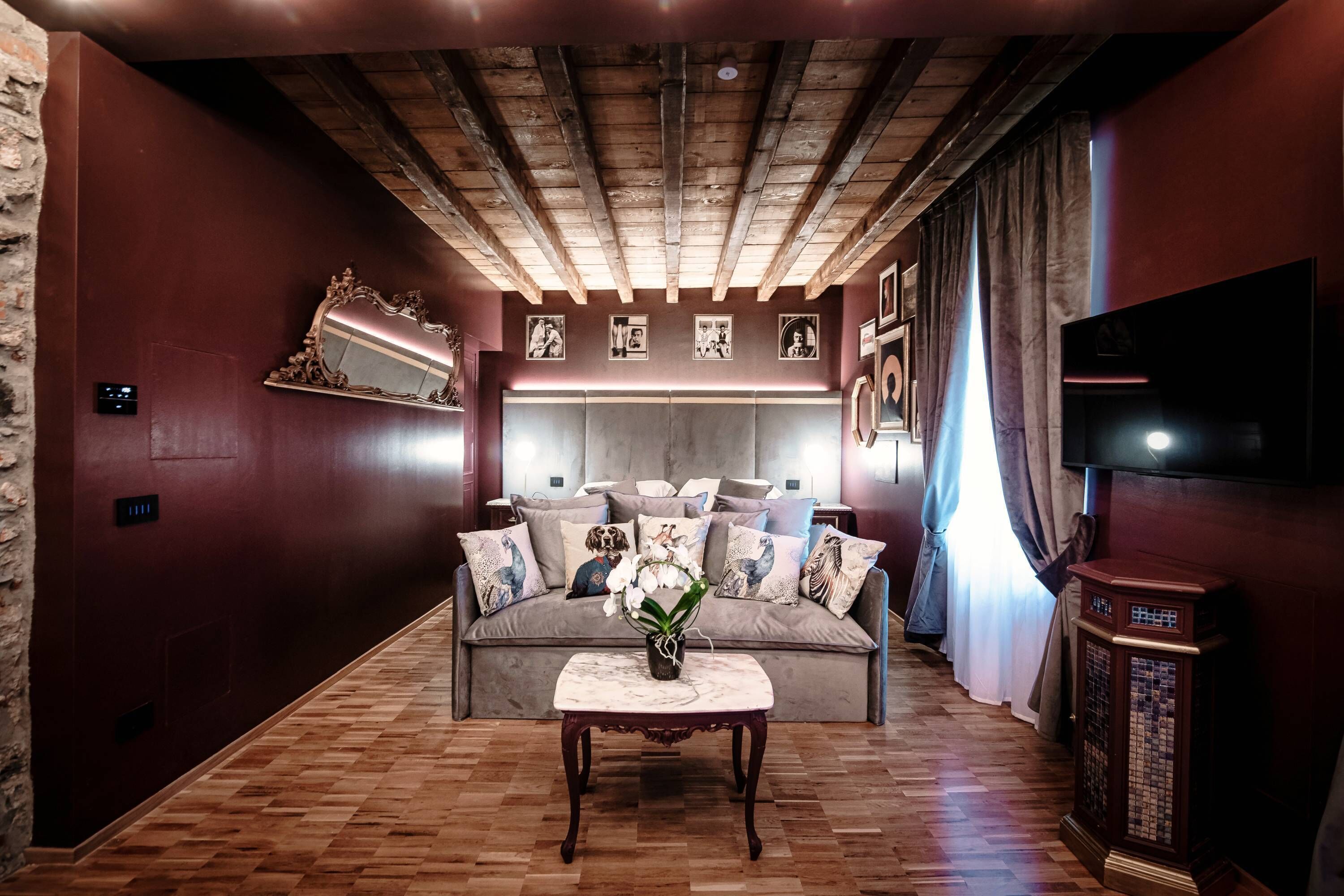 A cozy living room with a sofa, a coffee table, and a TV.
