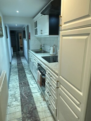Apartment, Multiple Beds | Private kitchen