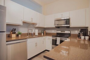 Fridge, microwave, oven, stovetop - CozySuites at The Block -Direct Skybridge Access#2 (Indianapolis)
