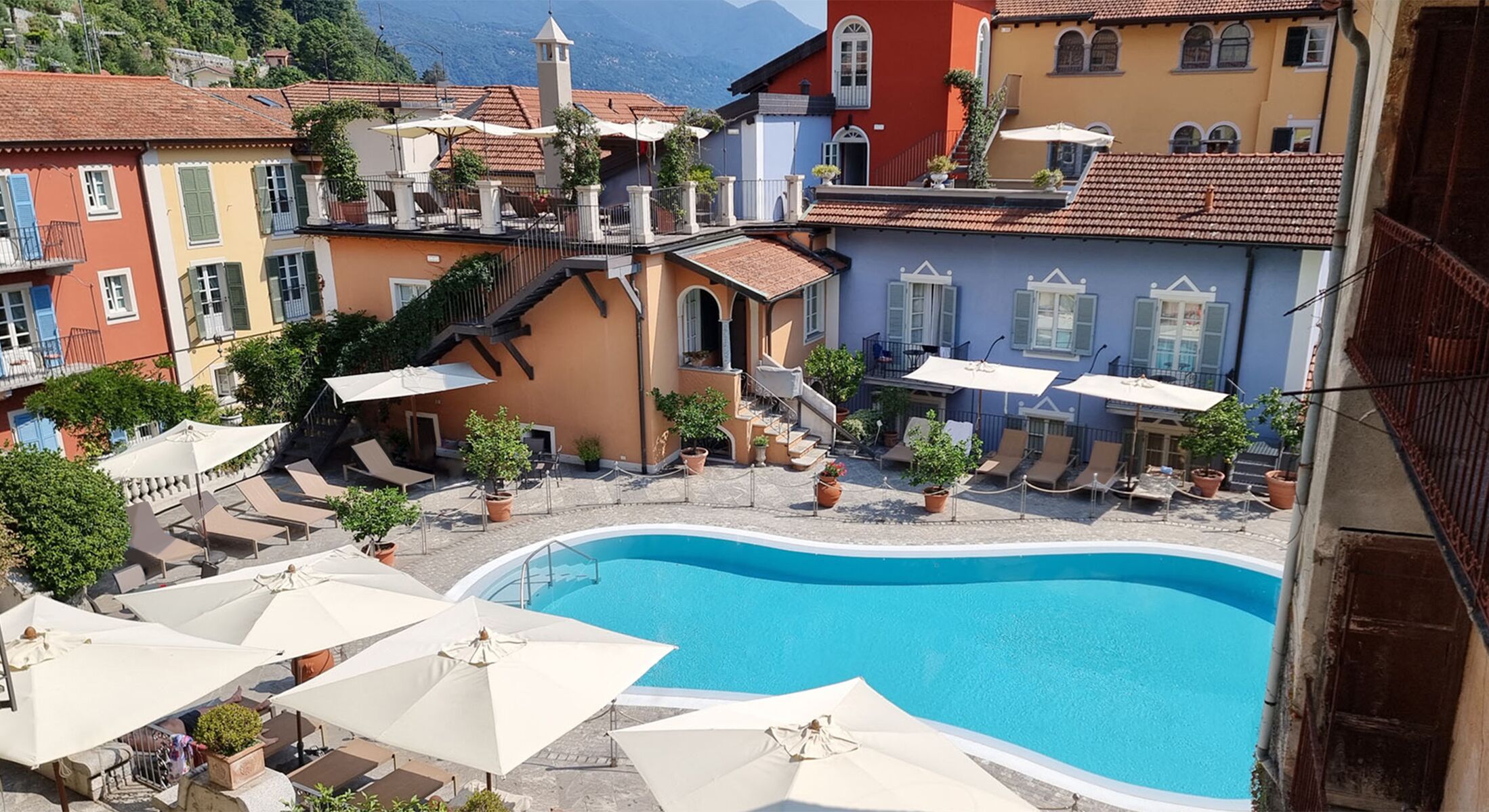 Seasonal outdoor pool, open 8:00 AM to 7:00 PM, pool umbrellas
