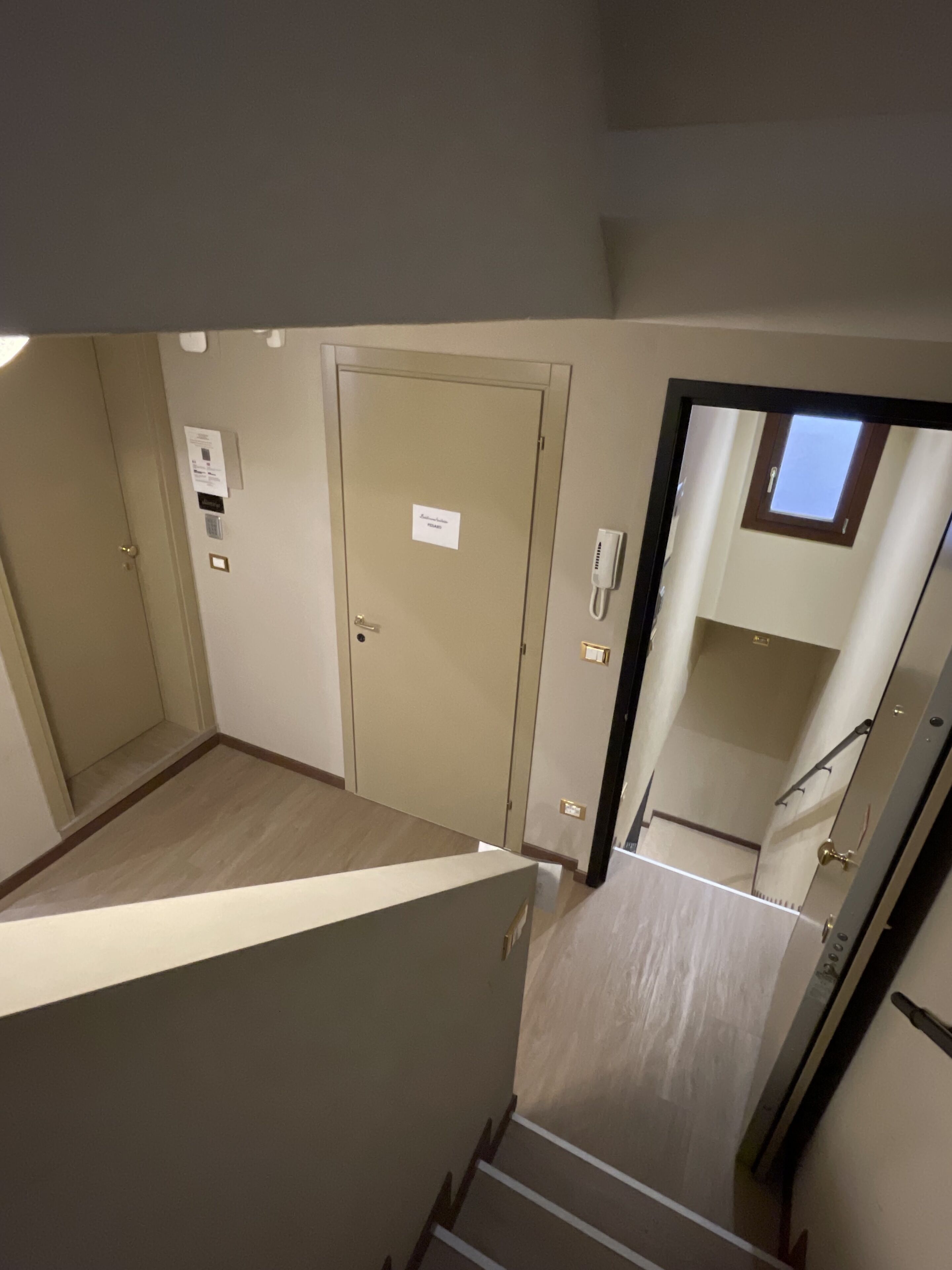 A staircase leading to a room with a door marked "Master Bedroom."