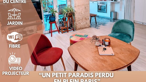 A modern living room with a kitchen in the background, featuring a dining area with a table and chairs, a red chair, and a teal chair. - ღ LE JARDIN PARISIEN - quiet with terrace wifi, video projector (Paris)