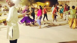 A group of people dancing in an outdoor setting at night. - Gujarat Resort Jaisalmer (Jaisalmer)