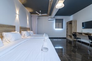Executive Quadruple Room | Iron/ironing board - The Ivory Suites by Armaan (Mombasa)
