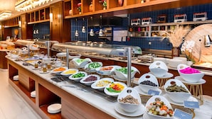 A buffet with various food stations, including fruits, vegetables, and meats. - Radisson Blu Hotel, Amman Galleria Mall (Amman)