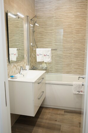 Combined shower/tub, hair dryer, bathrobes, slippers