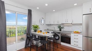 Coffee/tea maker, fridge, microwave, oven