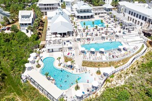 A resort with multiple swimming pools, sun loungers, and a large outdoor dining area. - WaterColor Beach Club, Bikes, 3 Min Walk to Seaside (Santa Rosa Beach)