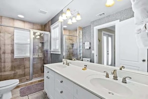 Shower, hair dryer, towels, shampoo