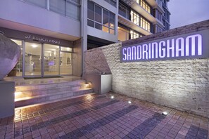 A modern building with a sign reading "37 Beach Road" and "Sandringham." - Sandringham 55 (Cape Town)