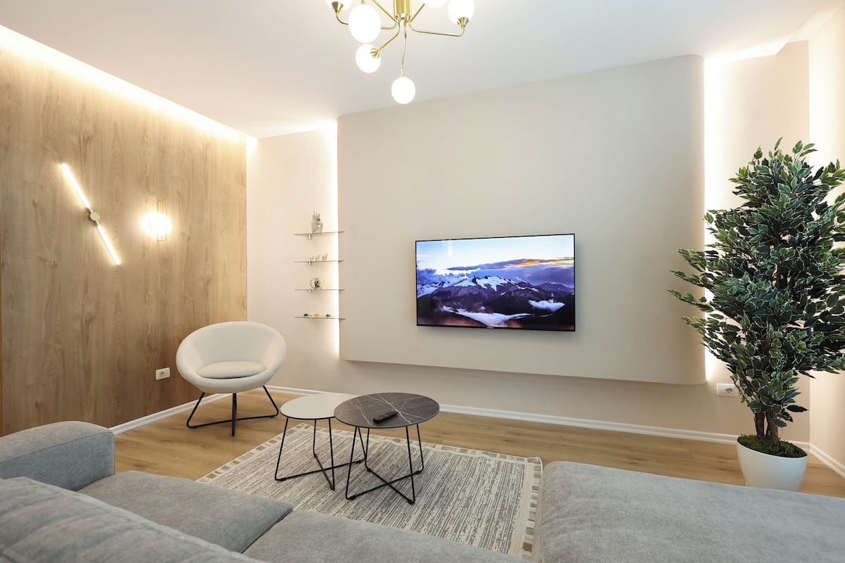 Royal Apartment | Living area | 55-inch Smart TV with digital channels, fireplace
