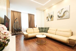 Economy Apartment | Living area | 55-inch Smart TV with digital channels, fireplace - Grandstay Apartments (Durrës)
