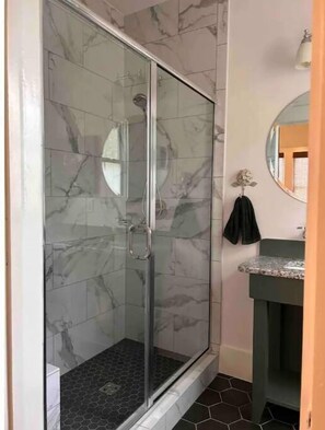 Shower, towels, soap, toilet paper