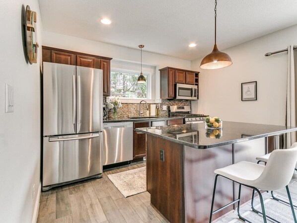 Fridge, microwave, oven, stovetop - Prime Location: Downtown Modern 3BR Retreat (Des Moines)