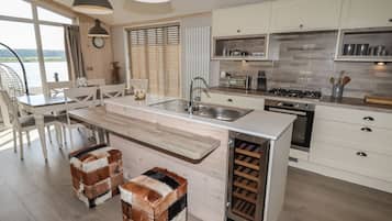 Fridge, electric kettle, toaster, cookware/dishes/utensils