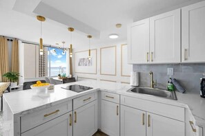 Fridge, microwave, stovetop, coffee/tea maker